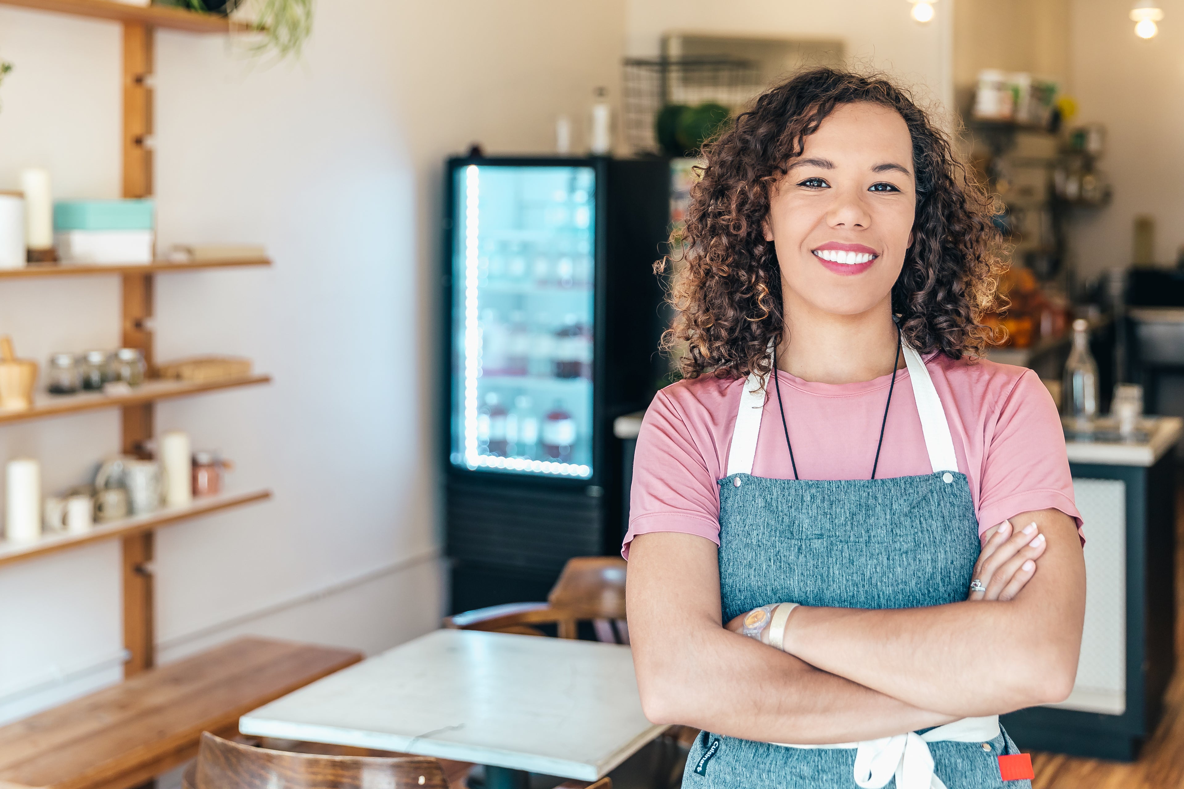 barista smiling in a cafe