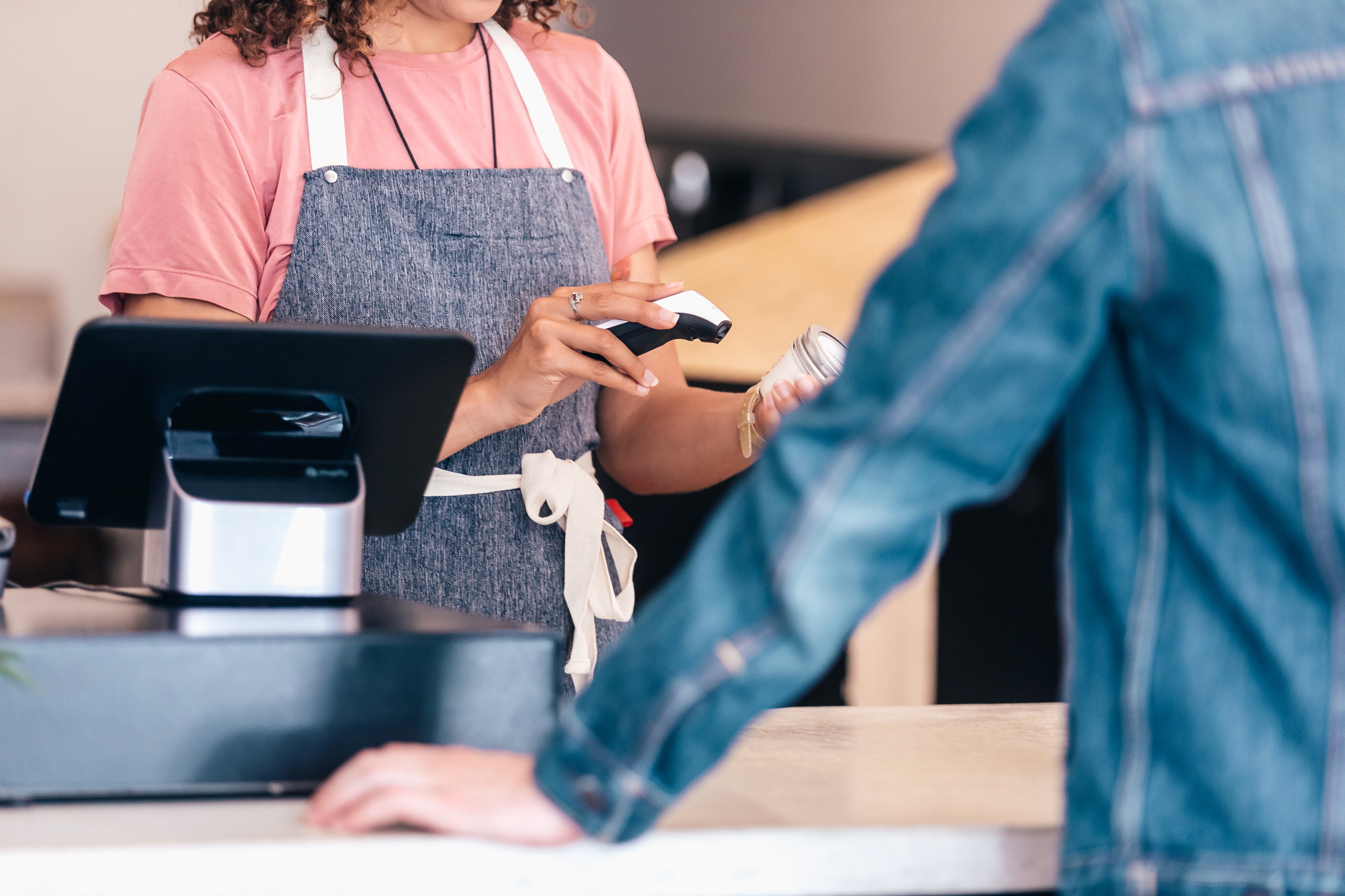 retail store worker scanning an item